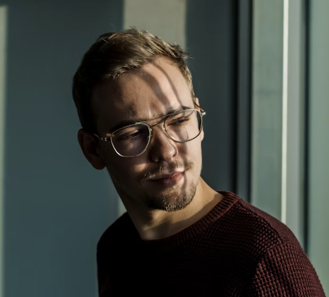 Thoughtful man wearing glasses